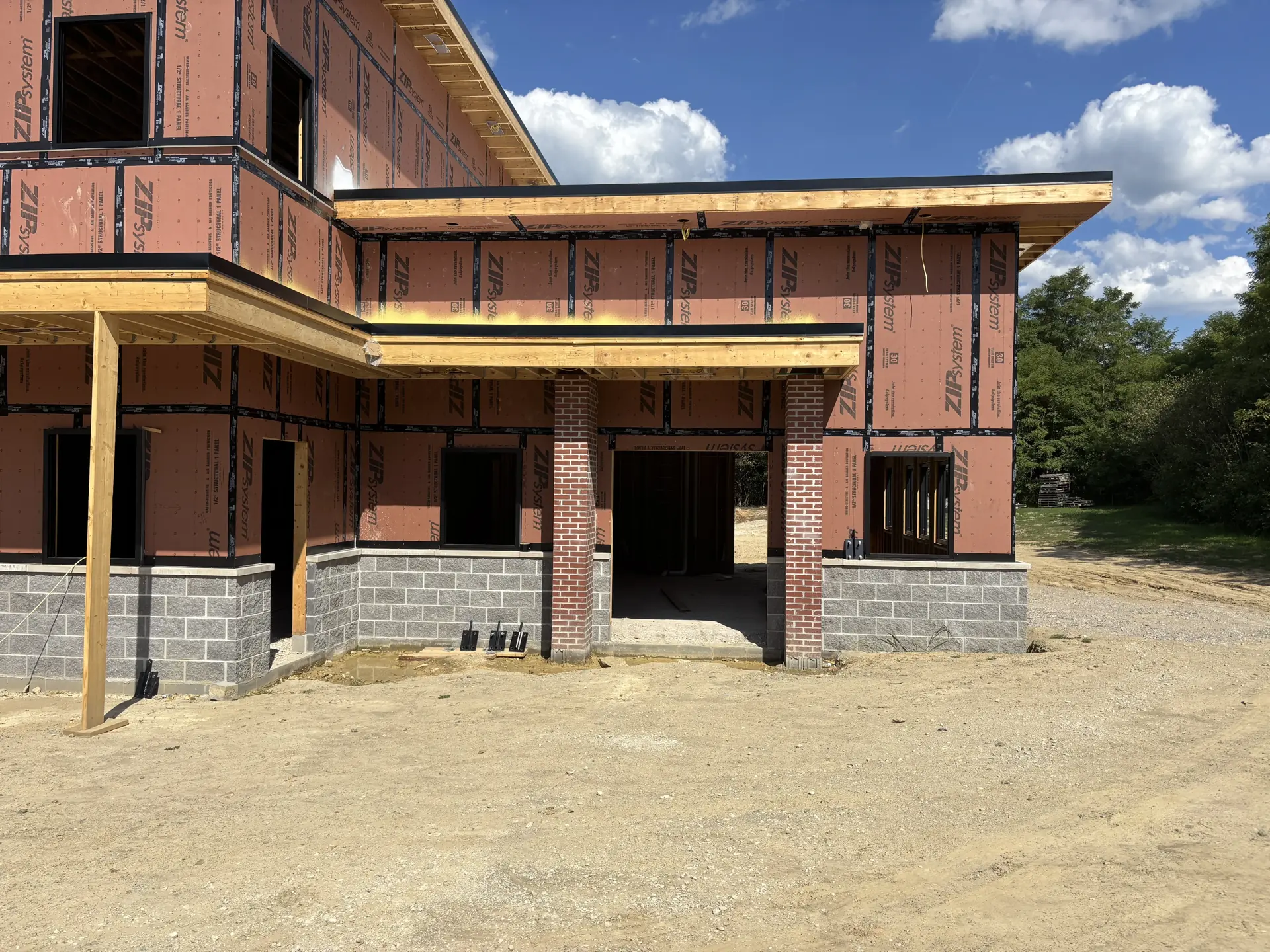 Front entrance with exposed sheathing